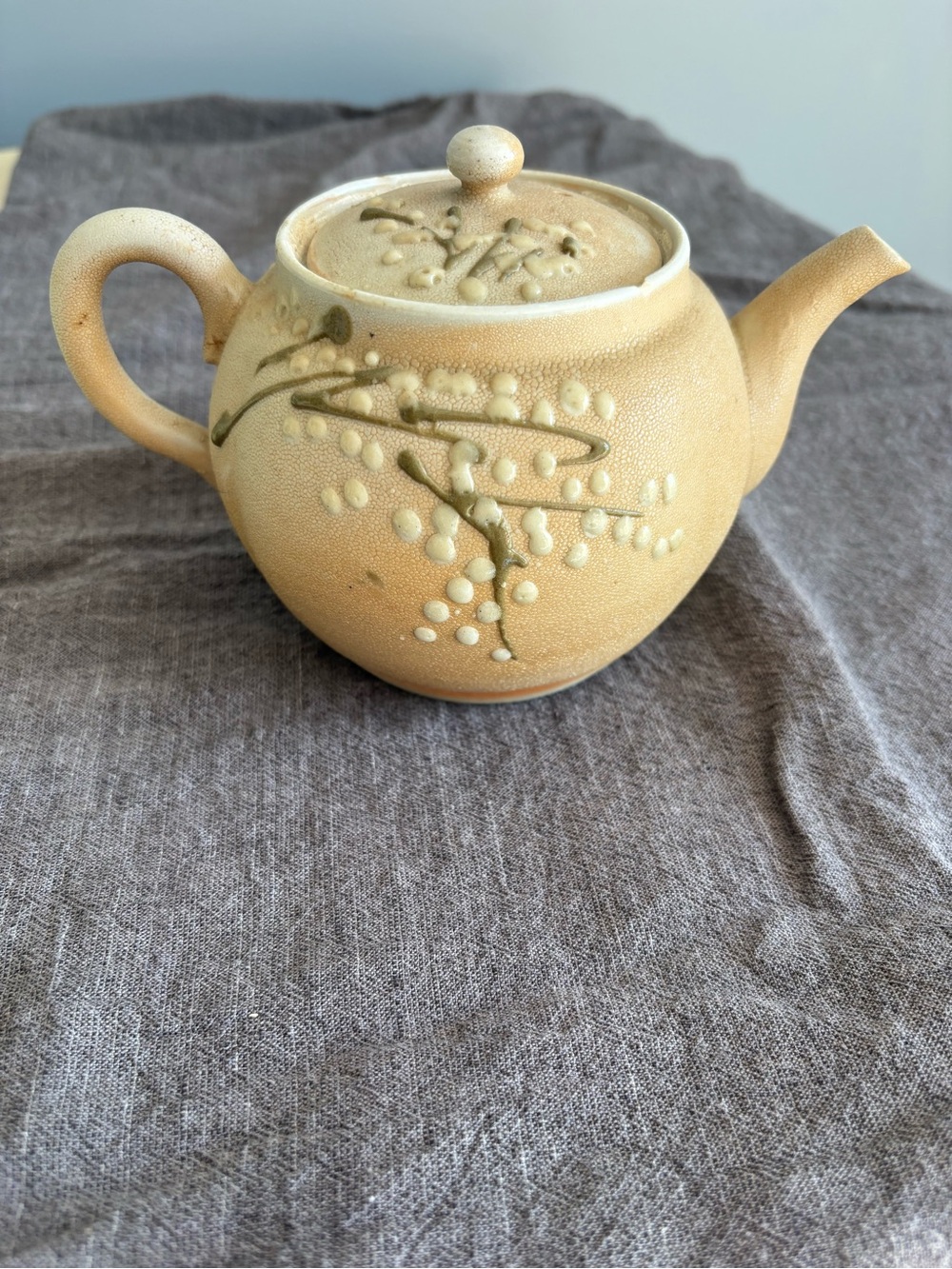 Handcrafted Beige Ceramic Teapot with Blossom Relief